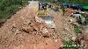 Heavy Komatsu Dozer Working Moving Rock And Clearing Land With Dump Trucks Dumping Rock Making Road